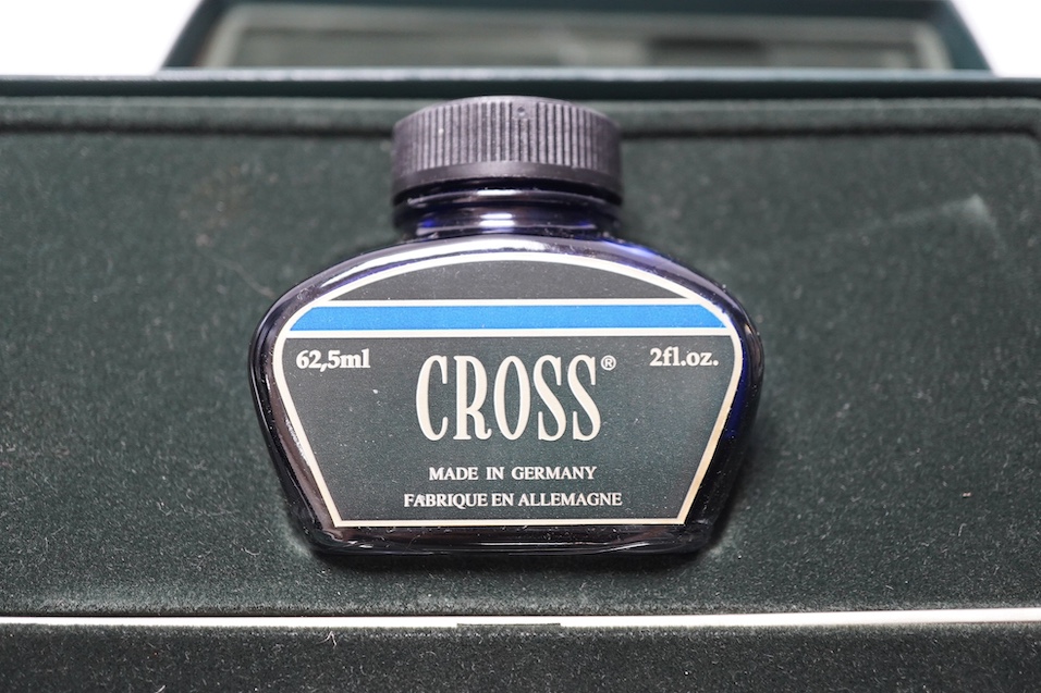 Two boxed pens; a Versace and a Cross, both with outer cardboard boxes. Condition - Versace pen good, display box good, outer box damaged. Cross pen good, ink bottle good, case damaged